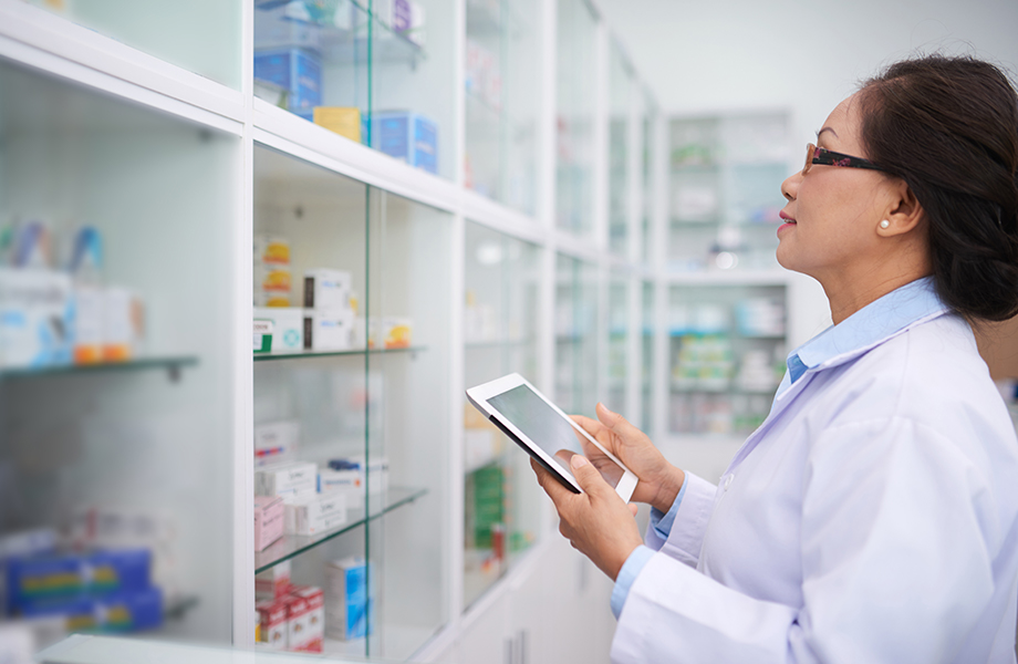 Pharmacist using NFC smart labels to find medication