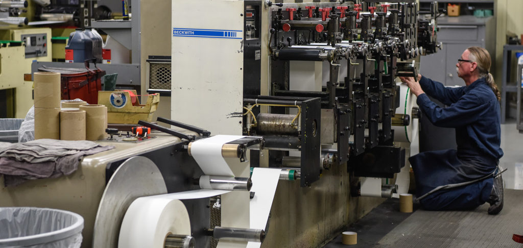 Man working on printing press