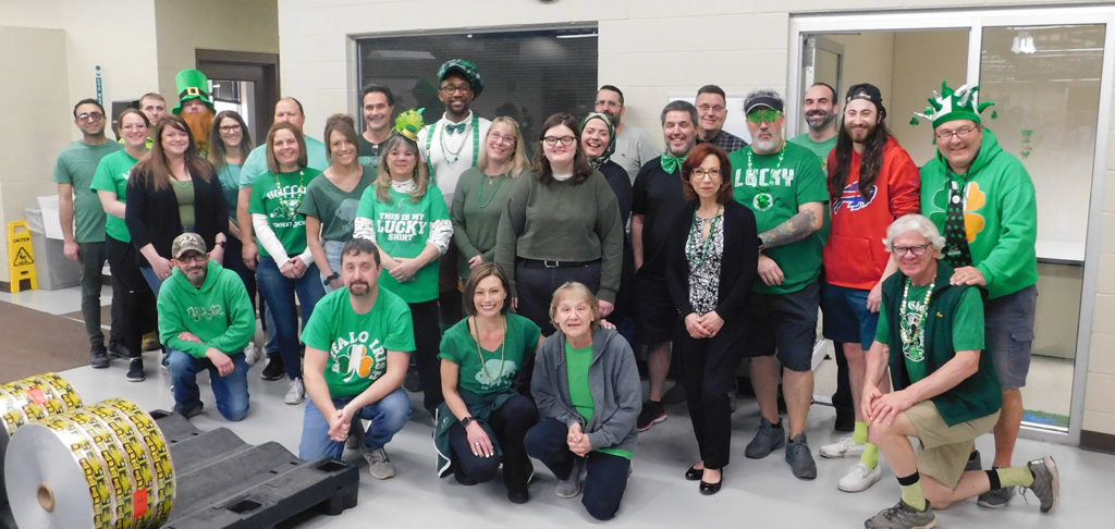 Group photo of Gintzler employees dressed up in green for St. Patrick's day