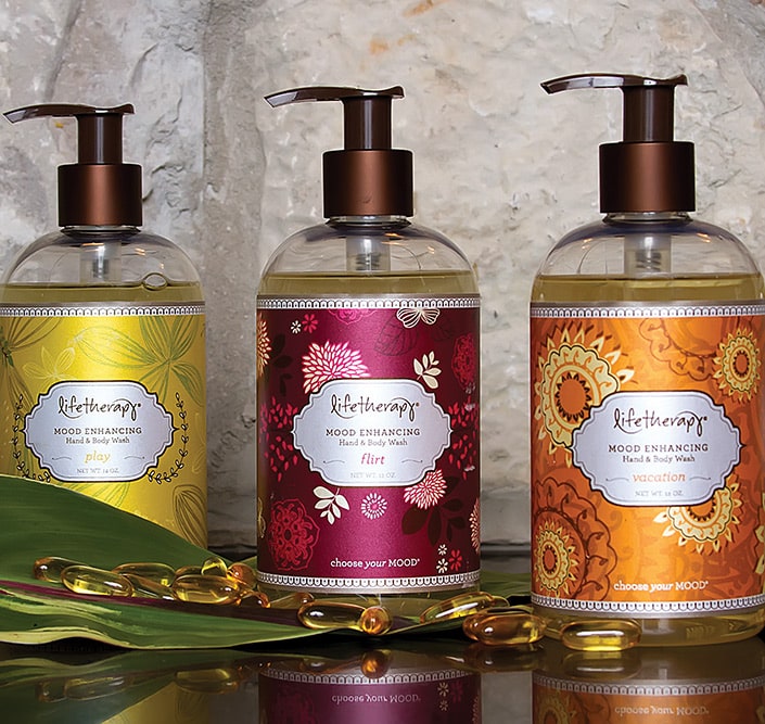 Three bottles of Life Therapy soaps with custom labels