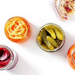 Top down view of 5 open food jars