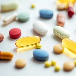 A collection of pills on a counter