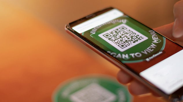 Scanning a QR code with a smartphone to order food