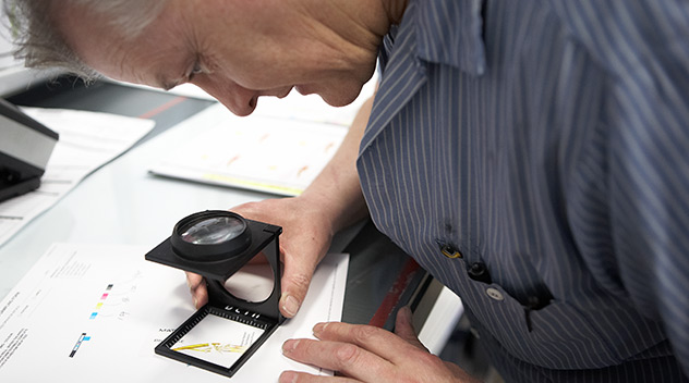 A man inspecting label quality