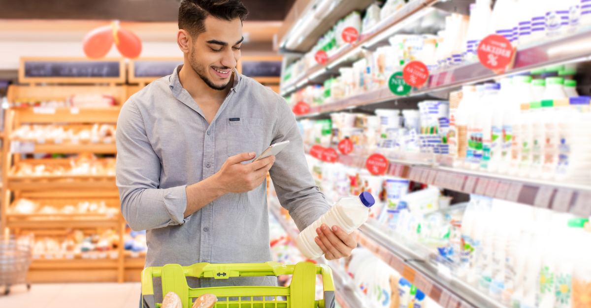 Man scanning smart label in store.