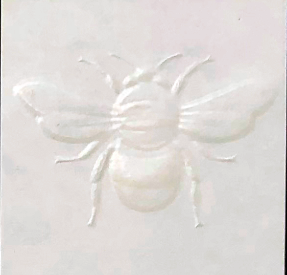 Sculpted blind embossed bee with screen varnish